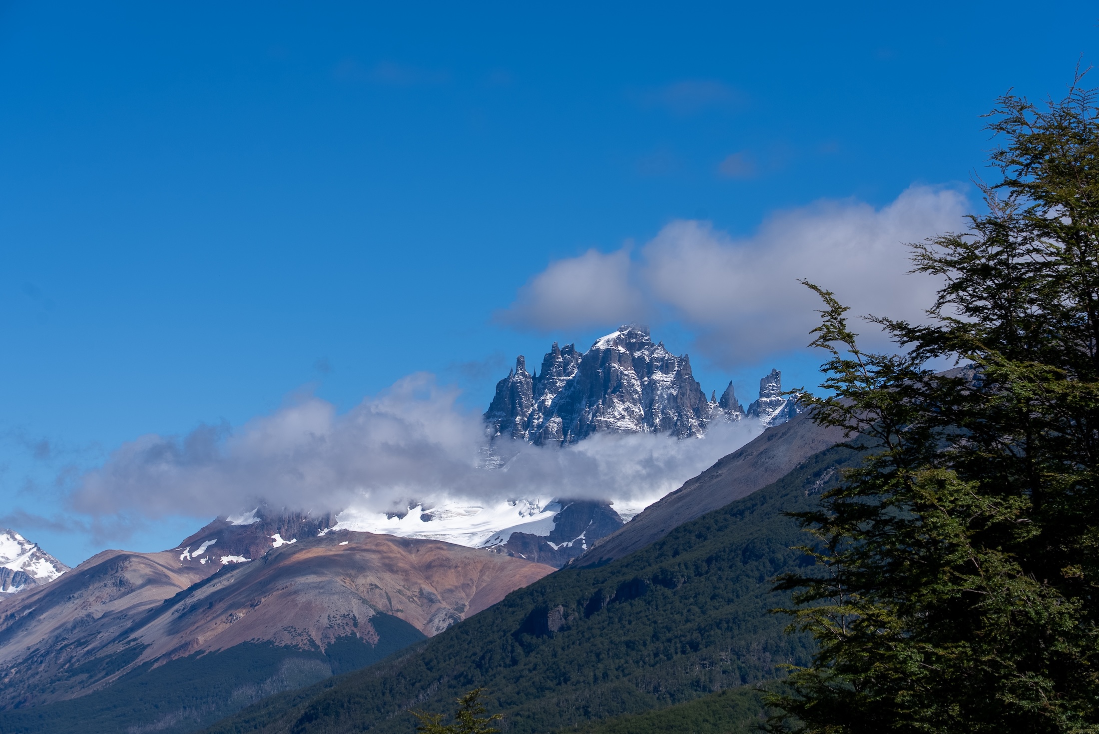 A snowcapped mountain, seen from a distance